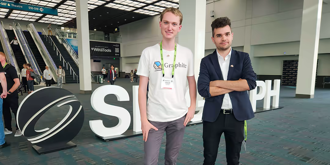 Keavon and Oliver standing in front of the SIGGRAPH conference sign
